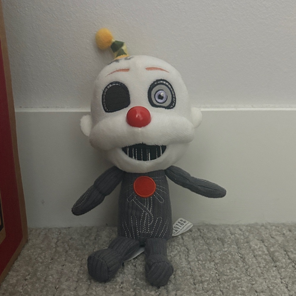 Gray and White Plush Clown with Red Accents